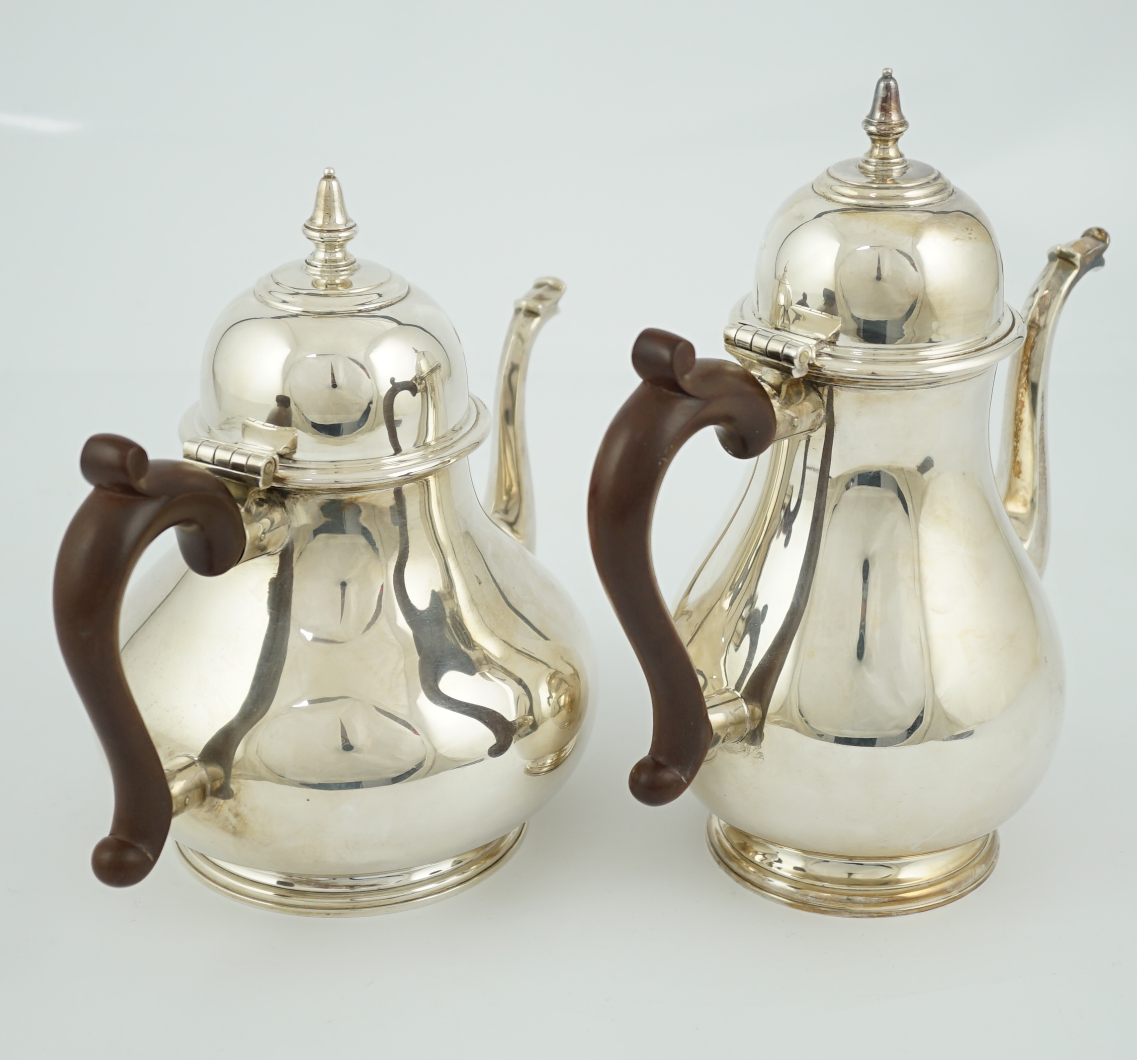 An Elizabeth II 18th century style silver coffee pot and a teapot, by William Comyns & Sons Ltd